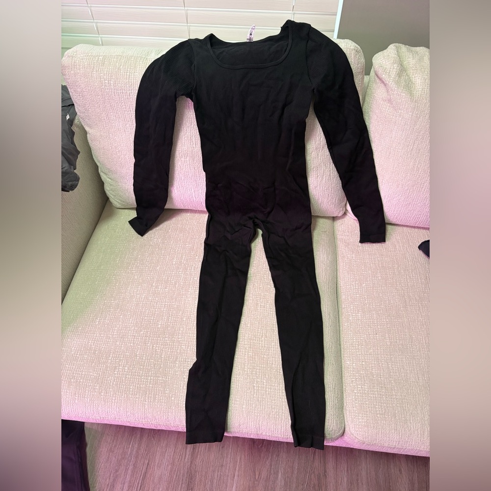 Women’s black full body suit